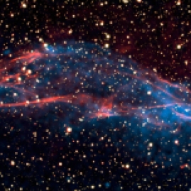 This composite image of X-ray data from Chandra (blue) and optical data from the Very Large Telescope (red) shows part of the roughly circular supernova remnant known as RCW 86. New details about the role of supernova remnants as the Milky Way's super-efficient particle accelerators have emerged thanks to this combined study. Astronomers have shown that the shock wave visible in this area is very efficient at accelerating particles and the energy used in this process matches the number of cosmic rays observed on Earth.